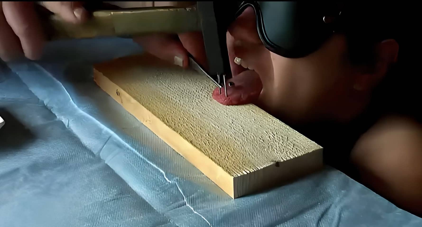 Pain Slut Having Her Tongue Nailed to a Piece of Wood